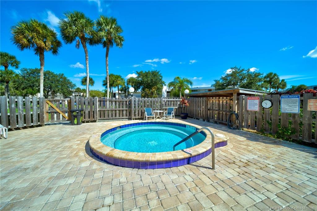 1950 Southwest Palm City Road, Unit 3201 Stuart, FL 34994 - Photo 38 of 51 a view of a swimming pool with a house
