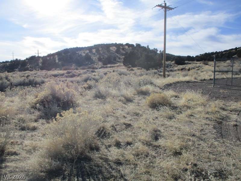 View of mountain backdrop featuring rural landscape