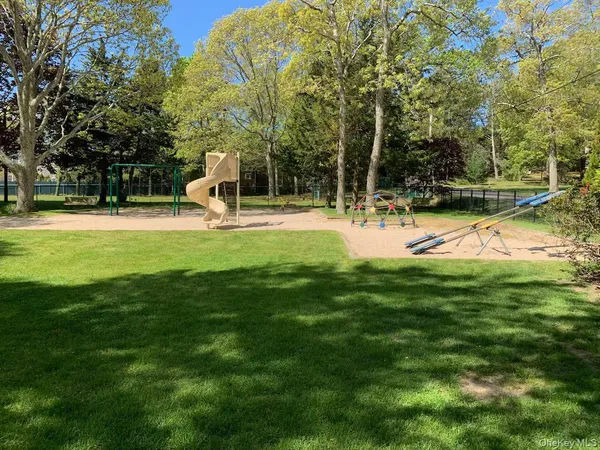 a view of a park with large trees