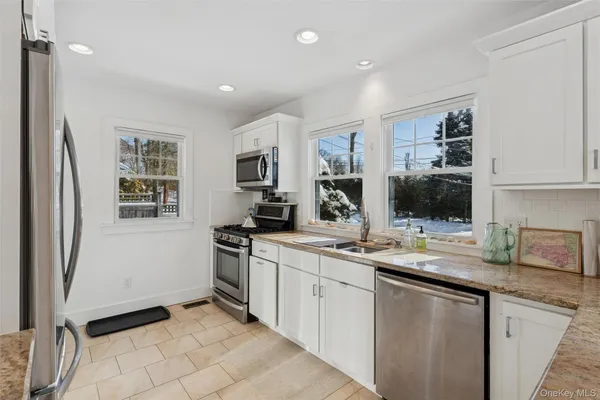 a kitchen with a sink stove and refrigerator