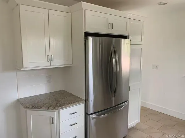 a kitchen with appliances and cabinets