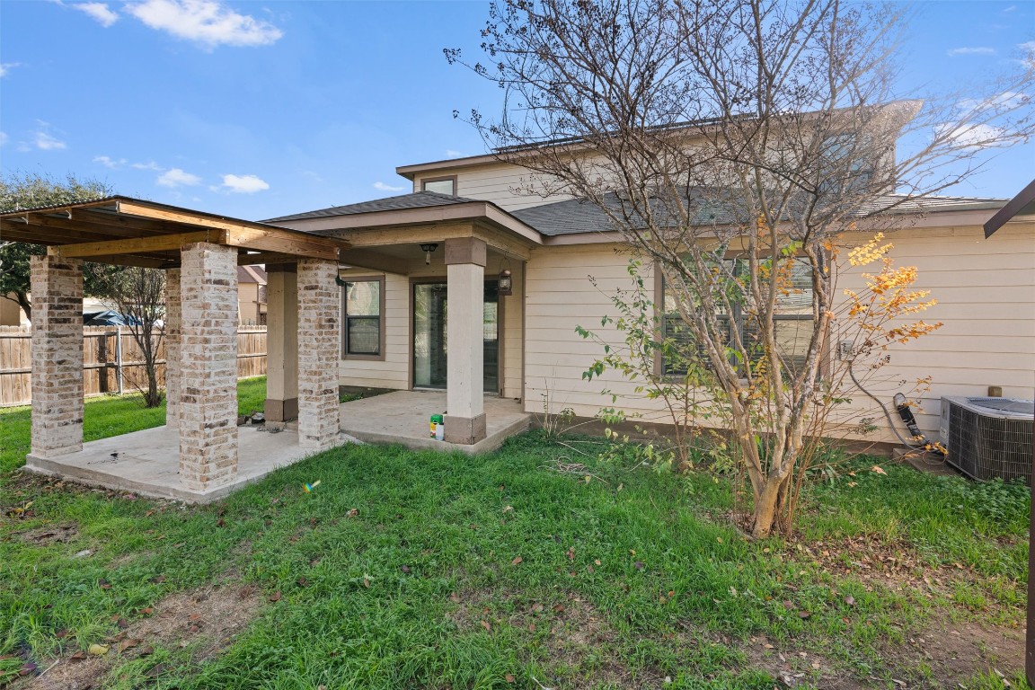 5700 Welsh Way Del Valle, TX 78617 - Photo 37 of 39 a view of a chair and table in backyard of the house