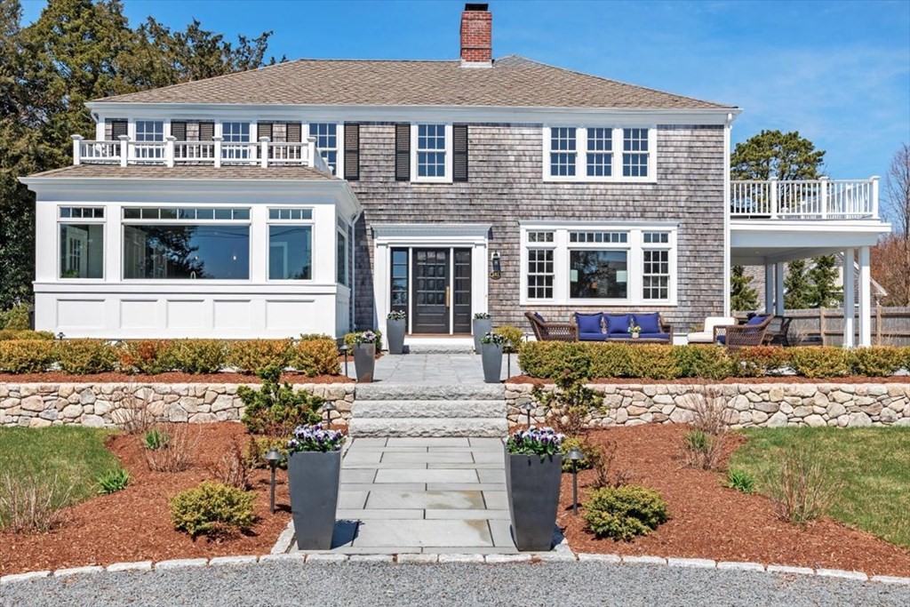 front view of a house with a yard