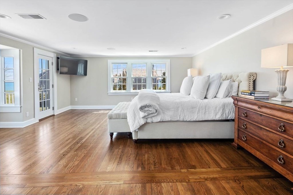 282 King Caesar Road Duxbury, MA 02332 - Photo 15 of 38 a bedroom with a bed and a night stand