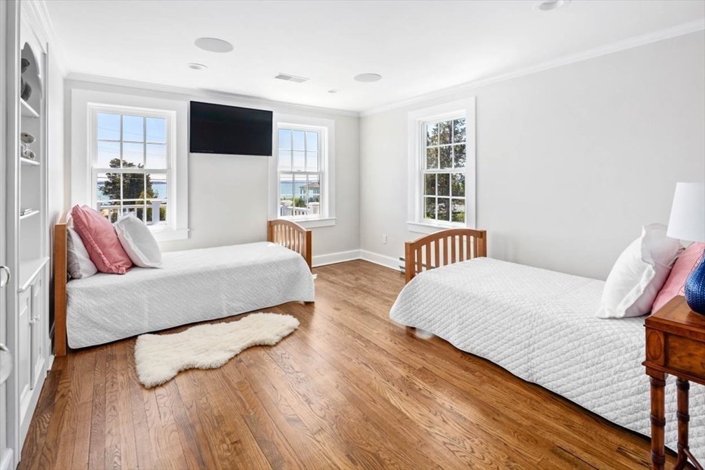 282 King Caesar Road Duxbury, MA 02332 - Photo 28 of 38 a bedroom with a bed and a flat screen tv