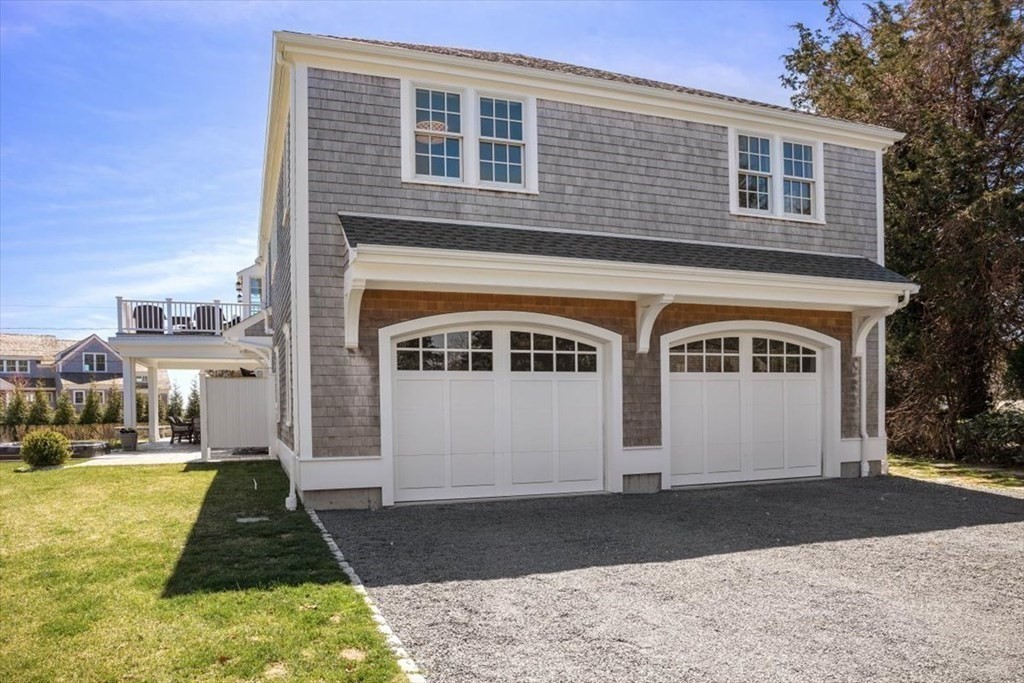 282 King Caesar Road Duxbury, MA 02332 - Photo 31 of 38 a front view of a house with a yard
