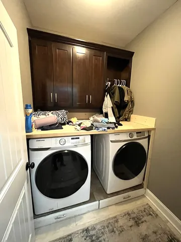 a utility room with dryer and washer