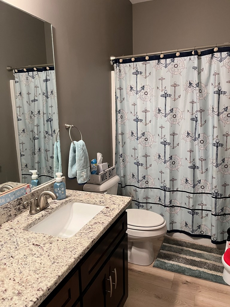 10 Maxwell Drive Fort Mitchell, AL 36856 - Photo 26 of 32 a bathroom with a granite countertop sink and a mirror