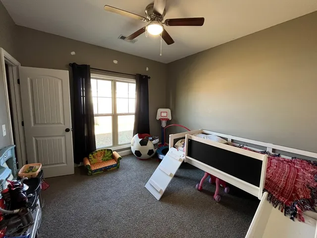 a room with furniture and a window