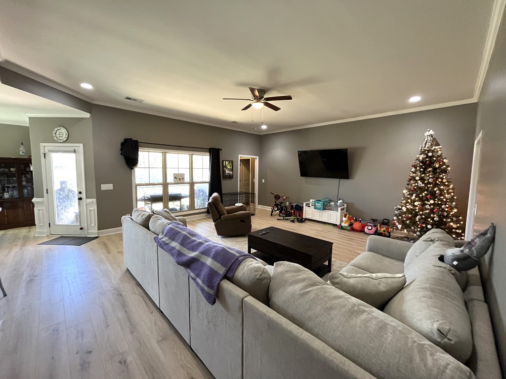 10 Maxwell Drive Fort Mitchell, AL 36856 - Photo 10 of 32 a living room with furniture or chandelier and a wooden floor