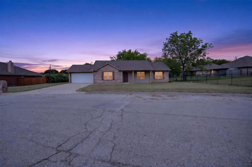 505 East 5th Street Springtown, TX 76082 - Photo 2 of 39 a front view of a house with a yard