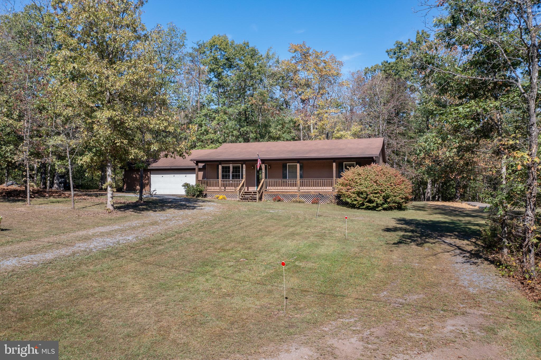 228 Sleepywoods Road Cross Junction, VA 22625 - Photo 1 of 34 a view of a house with a yard and sitting area