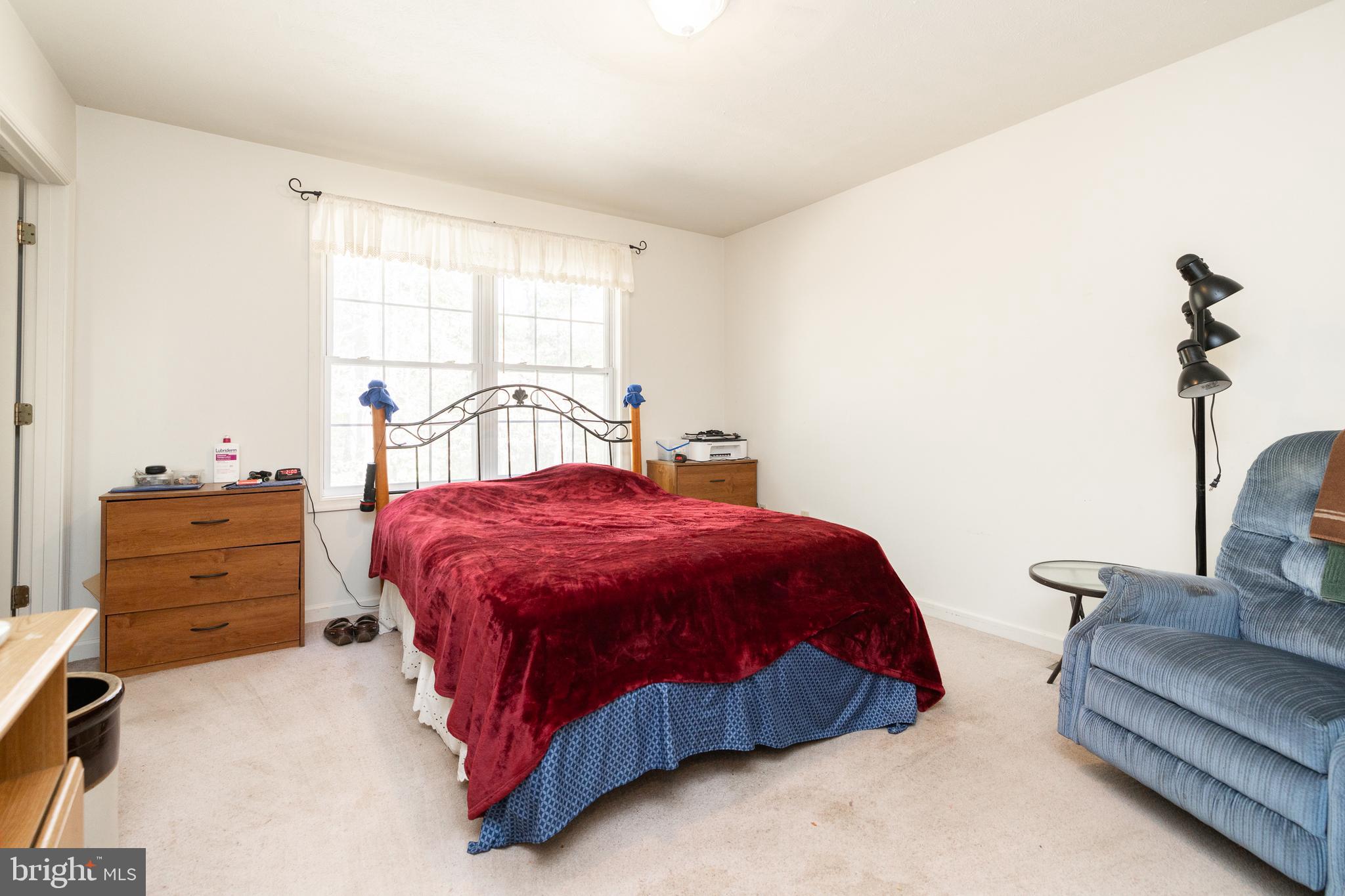 228 Sleepywoods Road Cross Junction, VA 22625 - Photo 15 of 34 a spacious bedroom with two beds and painting on the wall