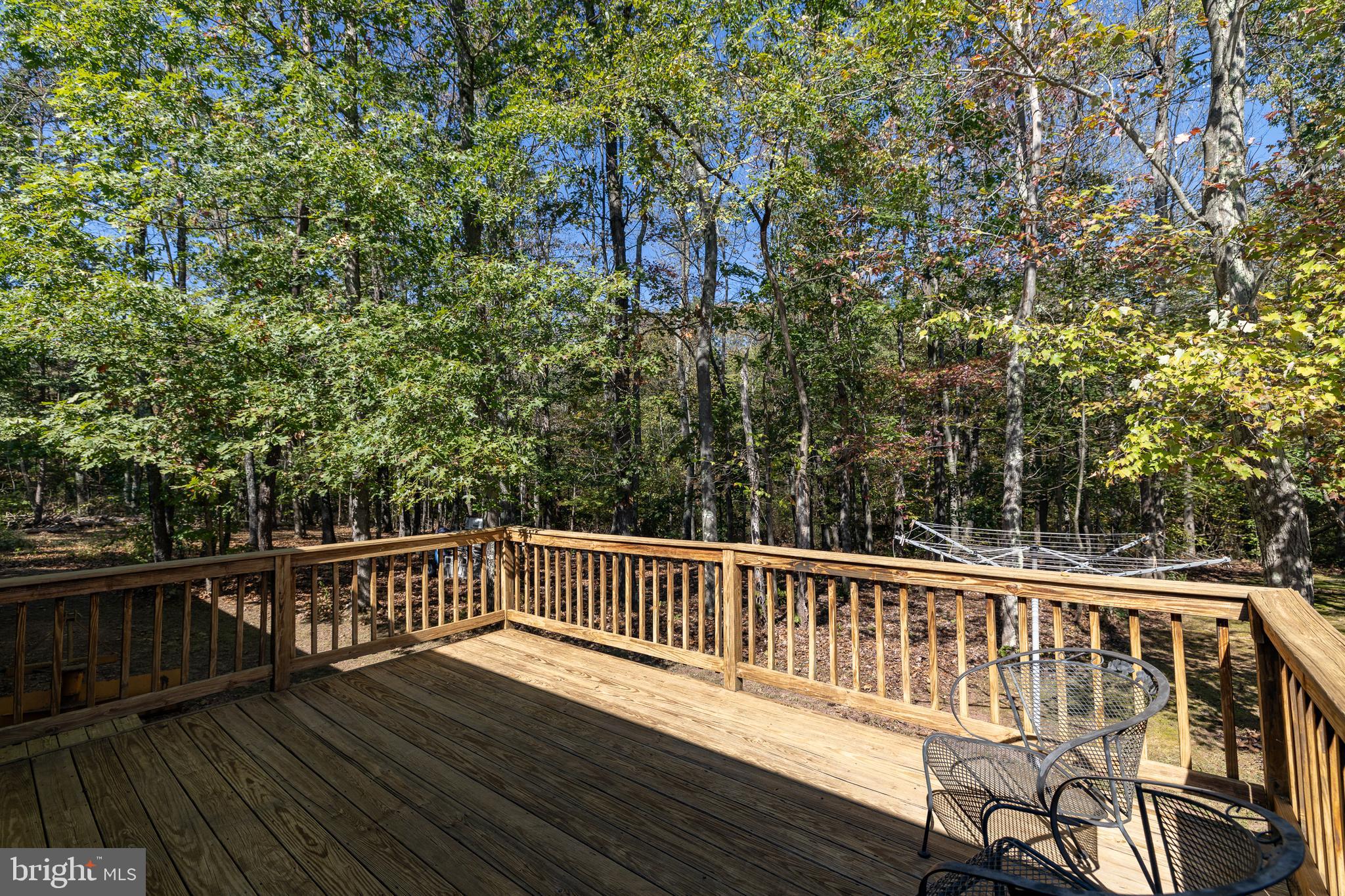 228 Sleepywoods Road Cross Junction, VA 22625 - Photo 24 of 34 a view of a wooden deck with a yard
