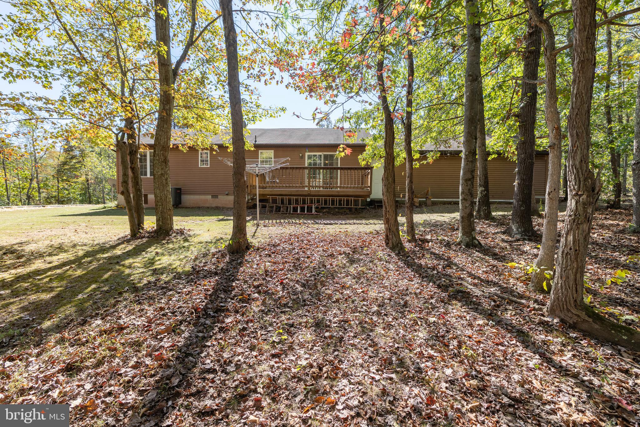 228 Sleepywoods Road Cross Junction, VA 22625 - Photo 27 of 34 a view of outdoor space with deck and trees