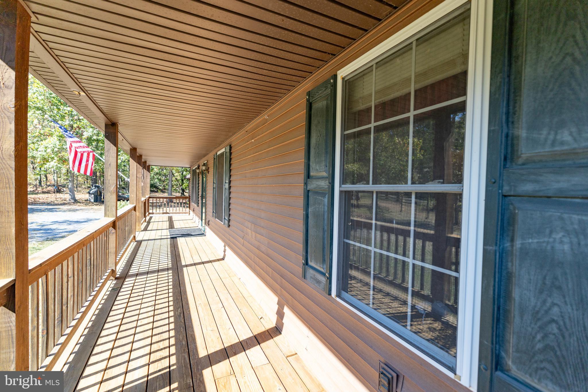 228 Sleepywoods Road Cross Junction, VA 22625 - Photo 28 of 34 a view of balcony with a large window and wooden floor