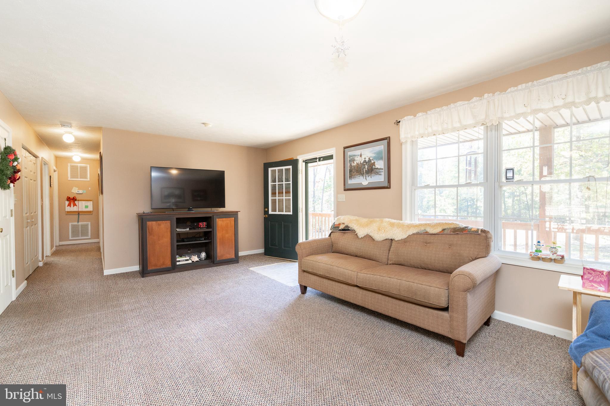 228 Sleepywoods Road Cross Junction, VA 22625 - Photo 4 of 34 a living room with furniture and a flat screen tv