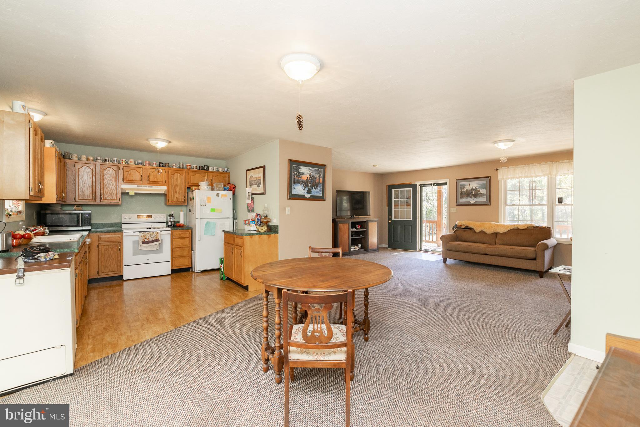 228 Sleepywoods Road Cross Junction, VA 22625 - Photo 7 of 34 a living room with furniture and a kitchen view