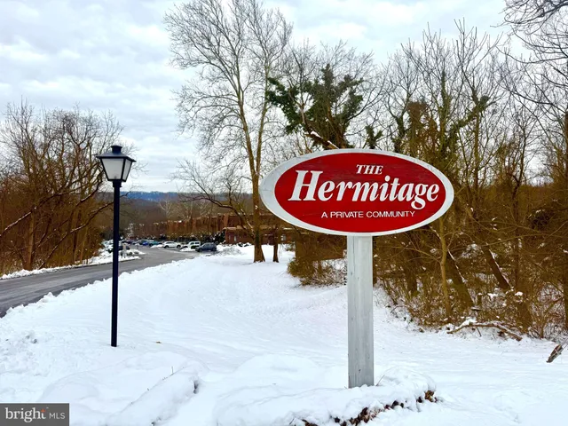 a sign board on the side of the road