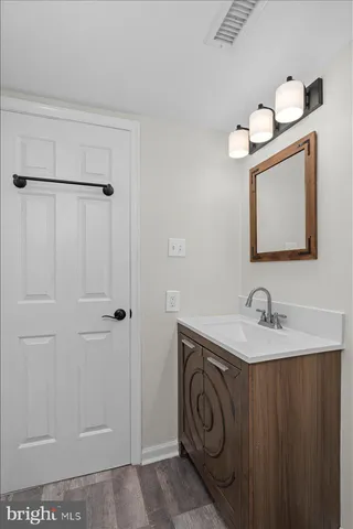 a bathroom with a sink and mirror