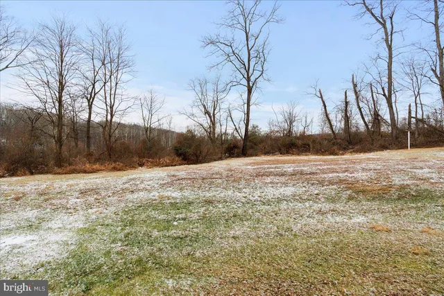 a living room with a table and chairs
