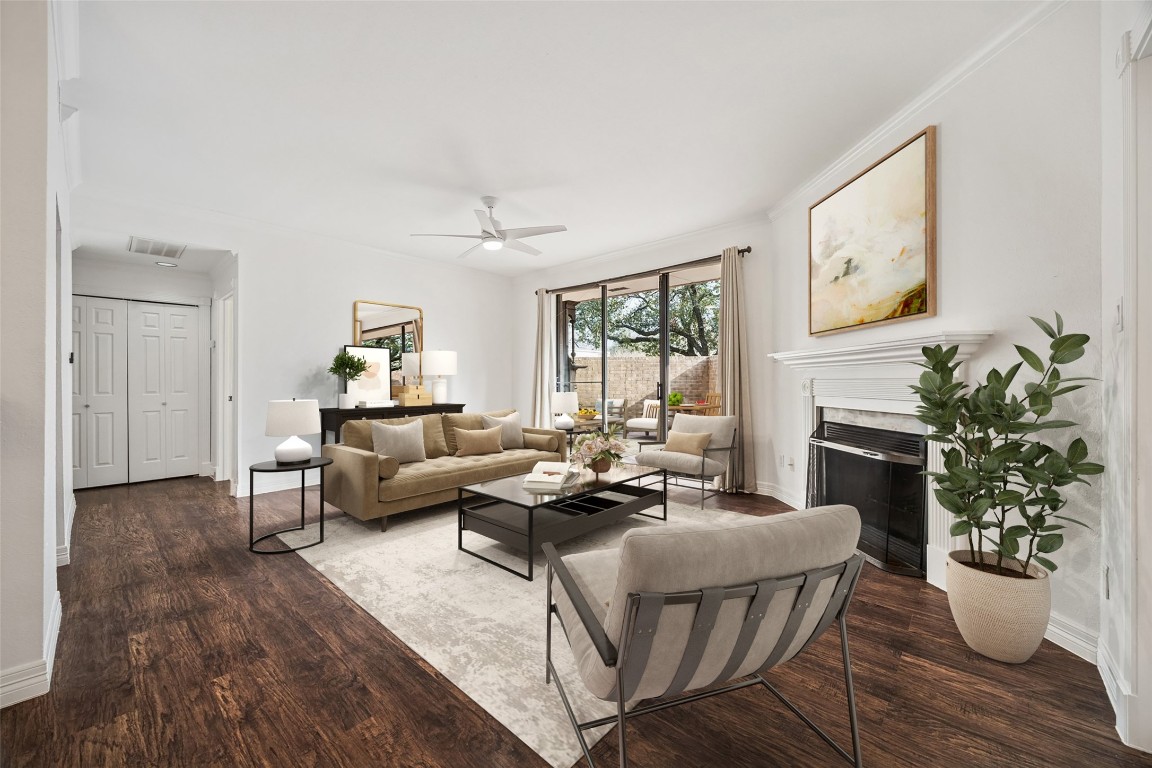 a living room with furniture and a fireplace