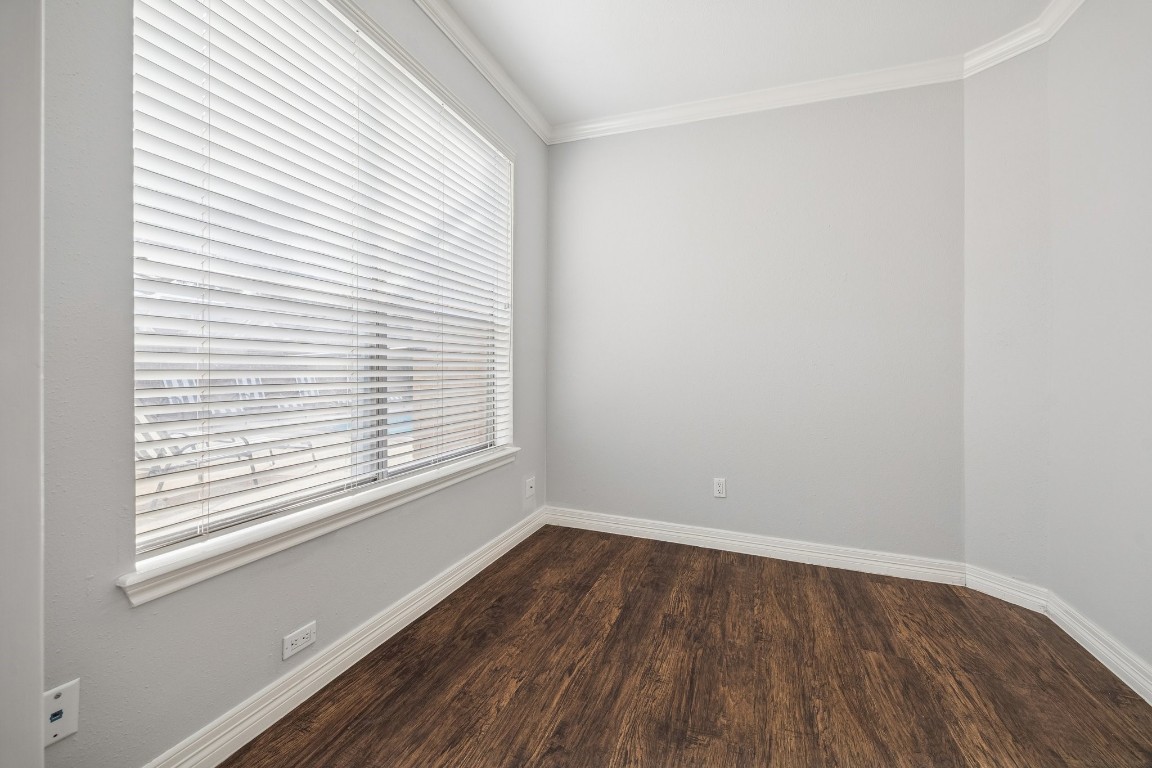5200 Weslayan Street, Unit 101 Houston, TX 77005 - Photo 13 of 19 an empty room with wooden floor and windows