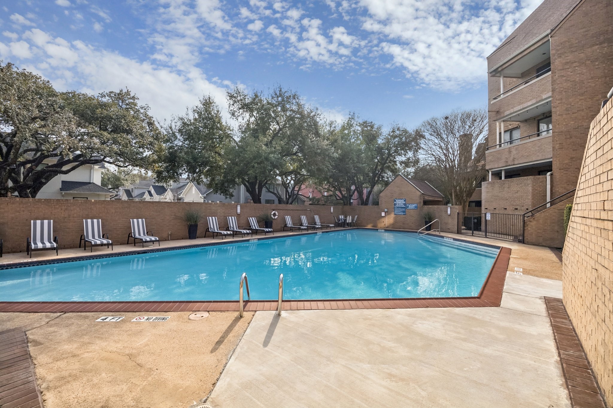 5200 Weslayan Street, Unit 101 Houston, TX 77005 - Photo 18 of 19 Pool view from condo entrance. Very quiet pool that was just resurfaced in summer 2025.