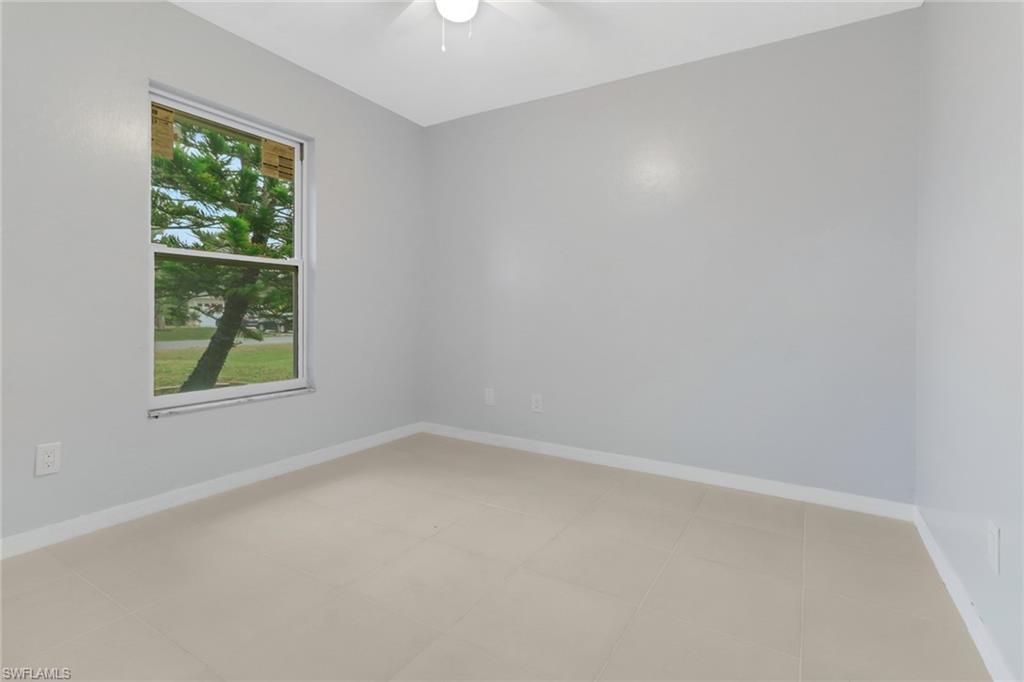 220 Ancona Street Fort Myers, FL 33913 - Photo 15 of 25 an empty room with a window