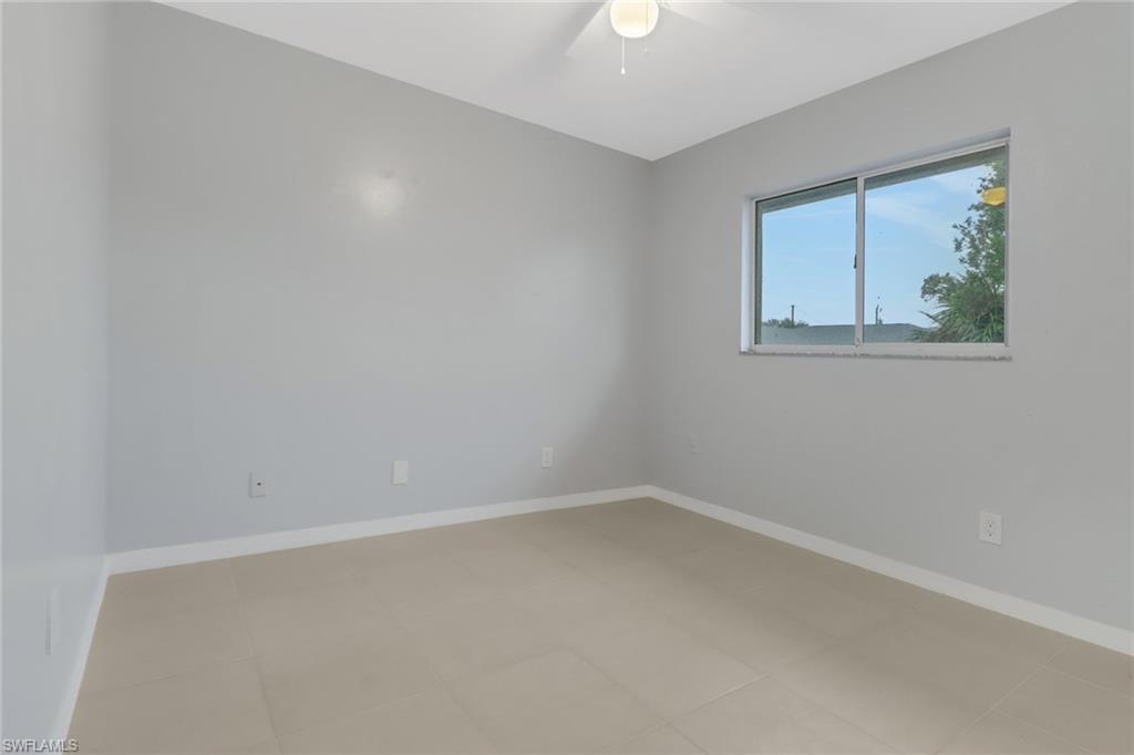 220 Ancona Street Fort Myers, FL 33913 - Photo 18 of 25 an empty room with a window
