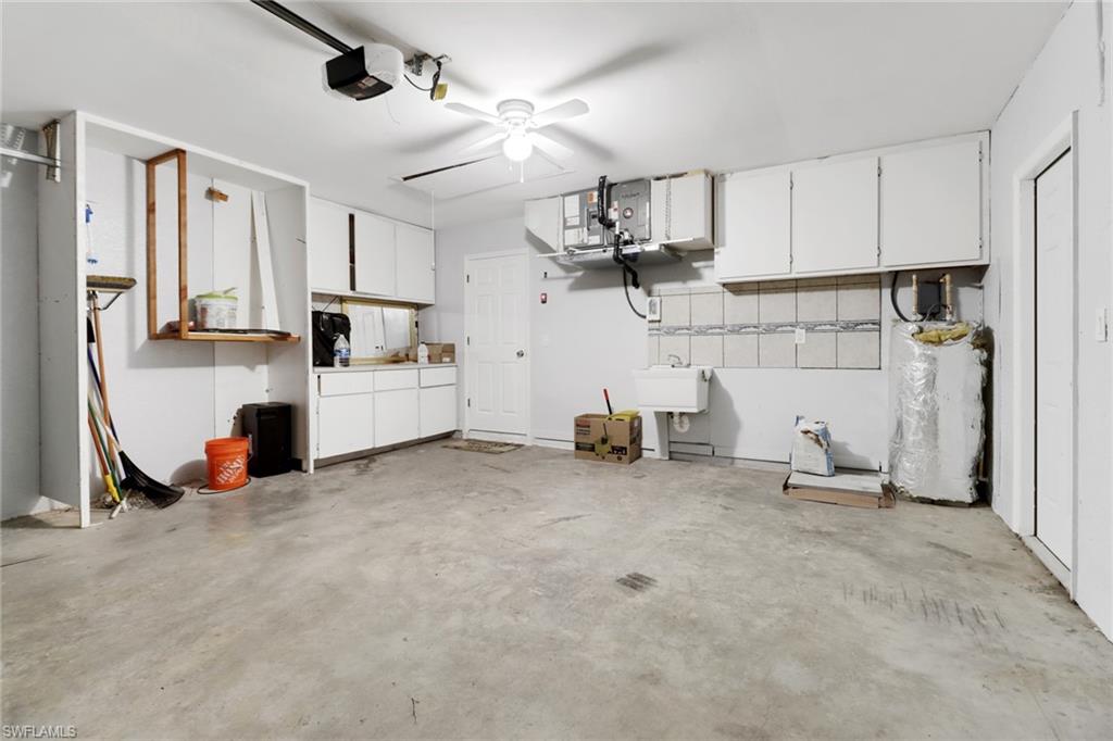 220 Ancona Street Fort Myers, FL 33913 - Photo 21 of 25 a view of a kitchen with furniture and a ceiling fan