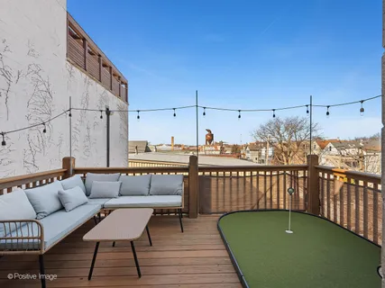 a view of a balcony with furniture
