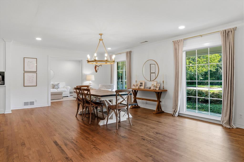 11439 Rosser Road Dallas, TX 75229 - Photo 7 of 35 a view of a dining room with furniture window and wooden floor