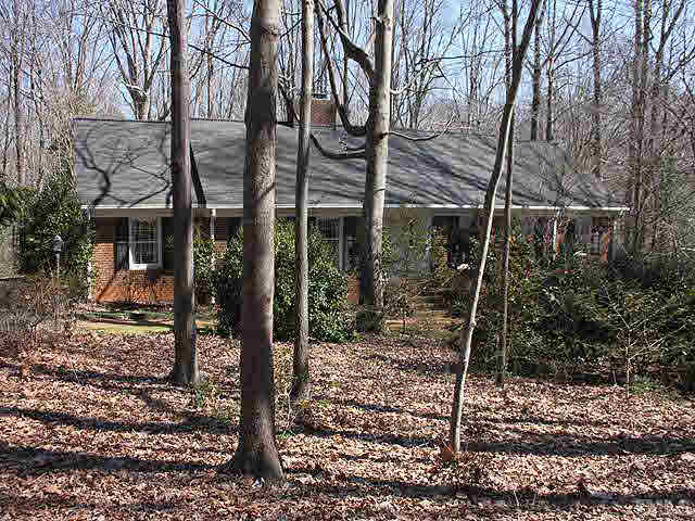7904 Netherlands Drive Raleigh, NC 27606 - Photo 1 of 15 Tucked away on 1.09 acre offering total privacy.