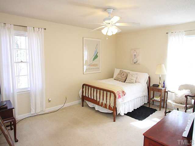 7904 Netherlands Drive Raleigh, NC 27606 - Photo 8 of 15 Master bedroom open to vanity/sink with separate bath area.