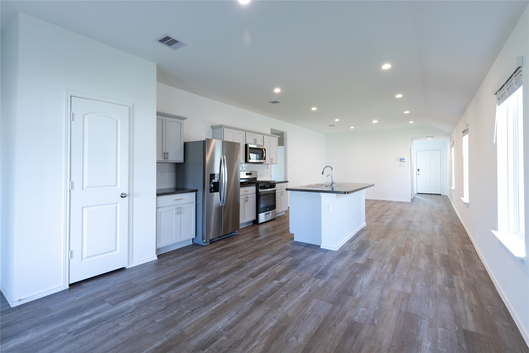 24330 Saddlestone Green Drive Spring, TX 77373 - Photo 11 of 19 The open family room is warmly integrated with the kitchen for easy entertaining