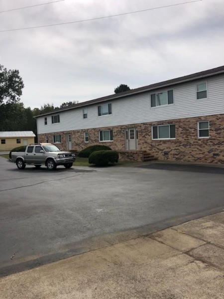 1326 Spring Street, Unit 10 Dover, TN 37058 - Photo 2 of 9 a car parked in front of a house