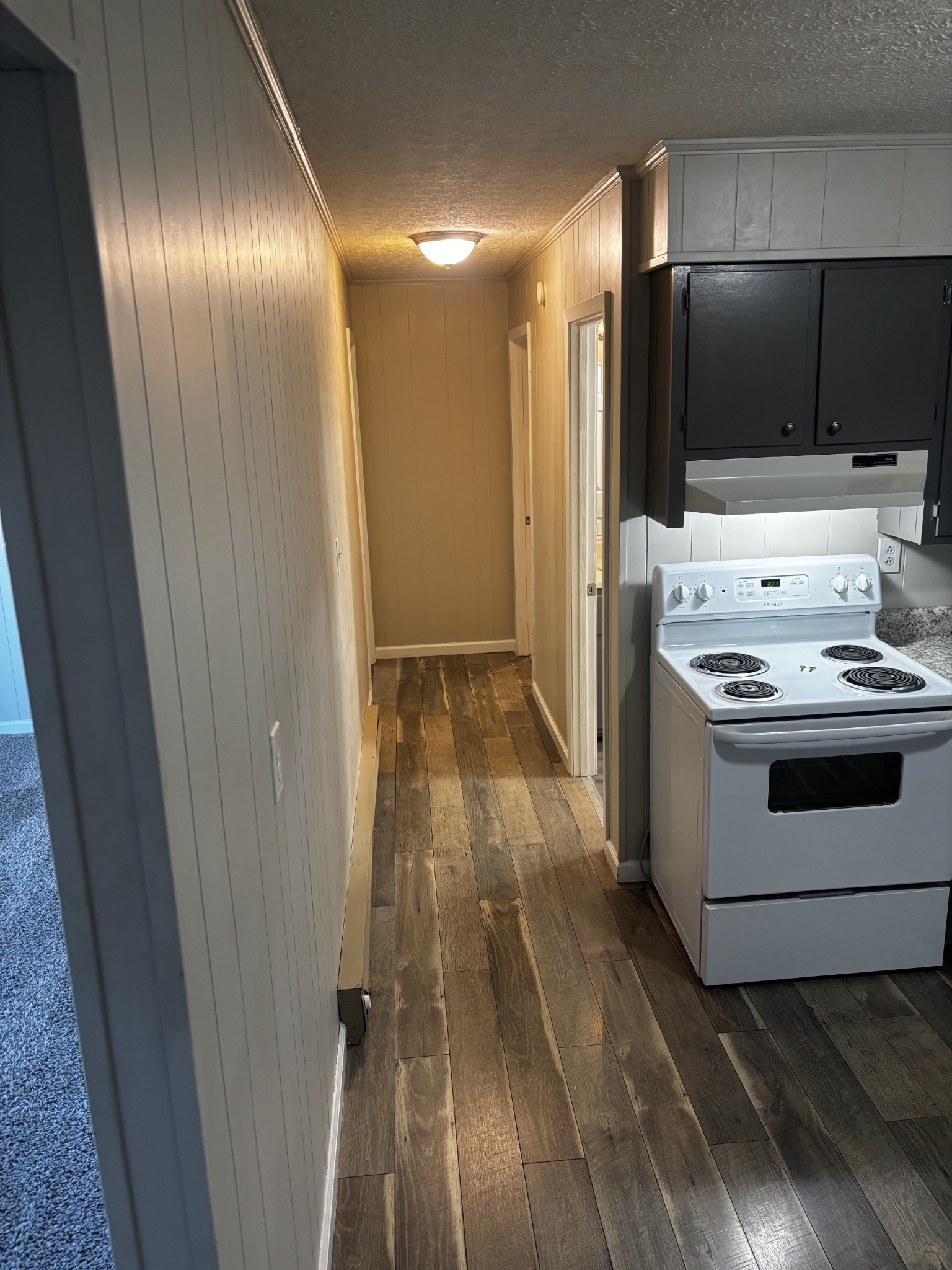1326 Spring Street, Unit 10 Dover, TN 37058 - Photo 4 of 9 a view of a kitchen from the hallway