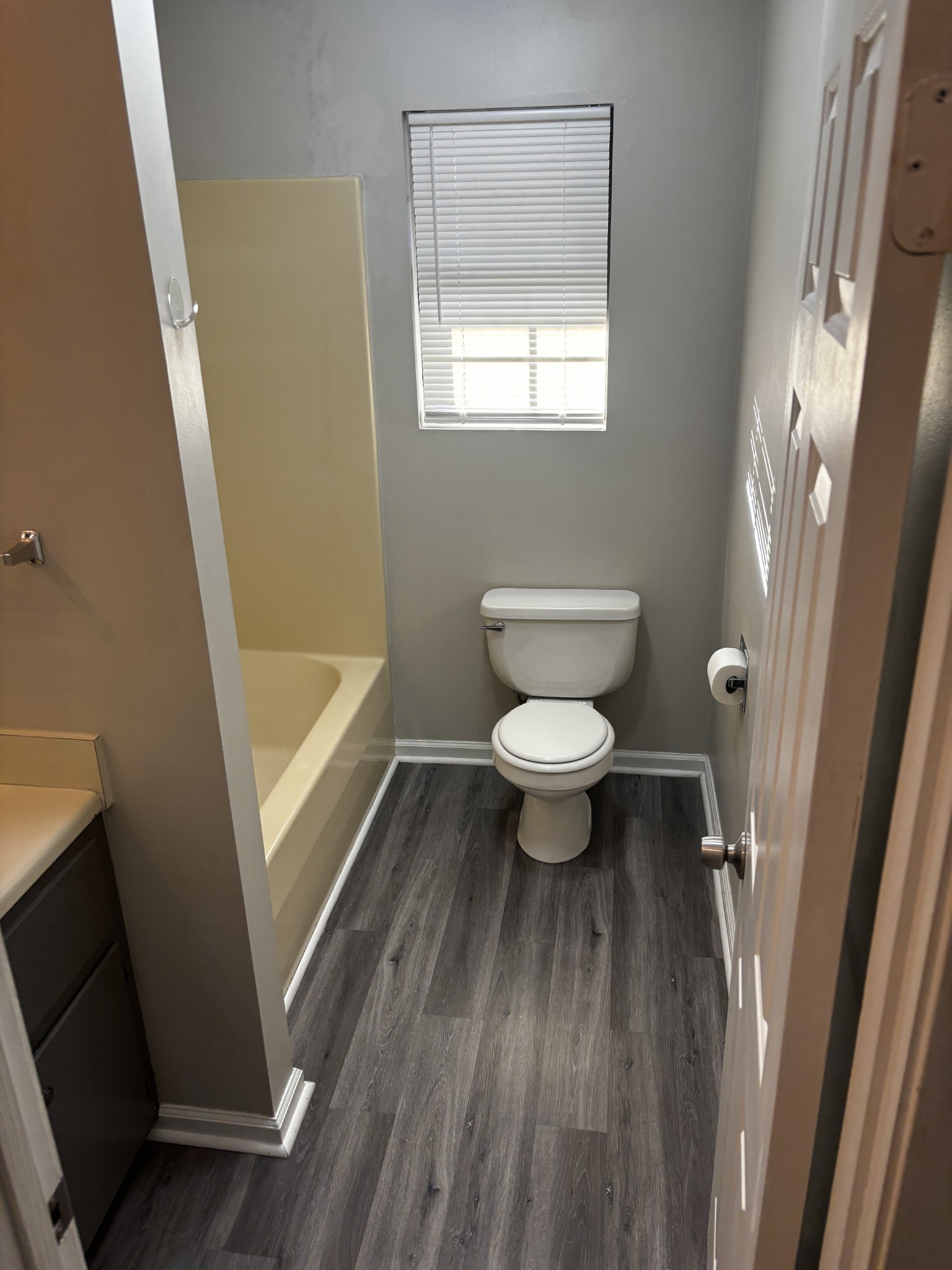 1326 Spring Street, Unit 10 Dover, TN 37058 - Photo 7 of 9 a bathroom with a toilet a sink a toilet and a mirror