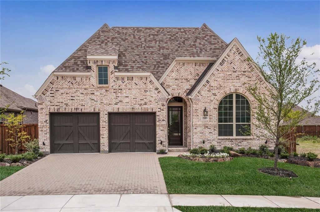 1630 Pebblebrook Lane Prosper, TX 75078 - Photo 1 of 1 front view of a house with a garden and plants