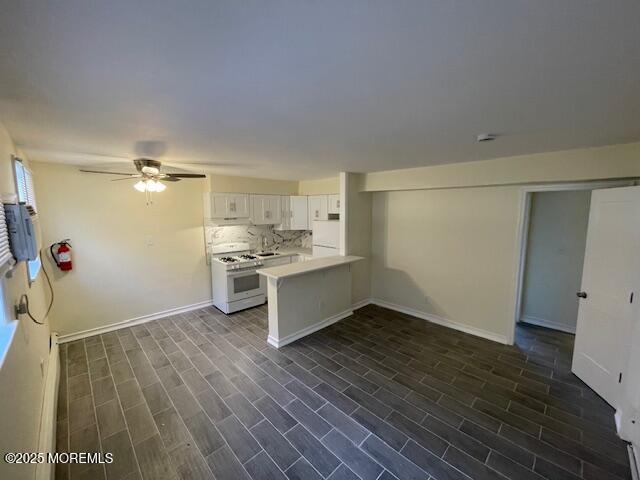 151 Stockton Avenue, Unit 7 Ocean Grove, NJ 07756 - Photo 3 of 5 a kitchen with a refrigerator and a stove top oven