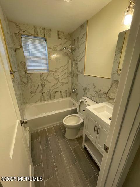 151 Stockton Avenue, Unit 7 Ocean Grove, NJ 07756 - Photo 5 of 5 a bathroom with a sink a toilet and shower