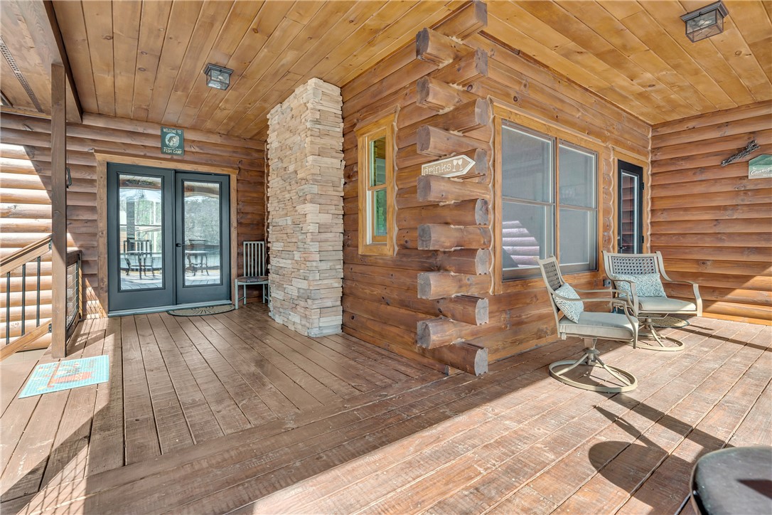 239 North Little River Road Salem, SC 29676 - Photo 11 of 43 This inviting patio, clad in warm wood, offers a perfect outdoor retreat.
