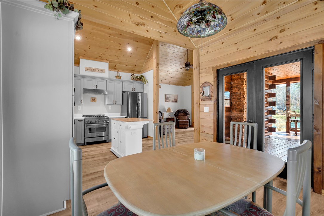 239 North Little River Road Salem, SC 29676 - Photo 14 of 43 This inviting kitchen and dining area features abundant natural wood finishes.