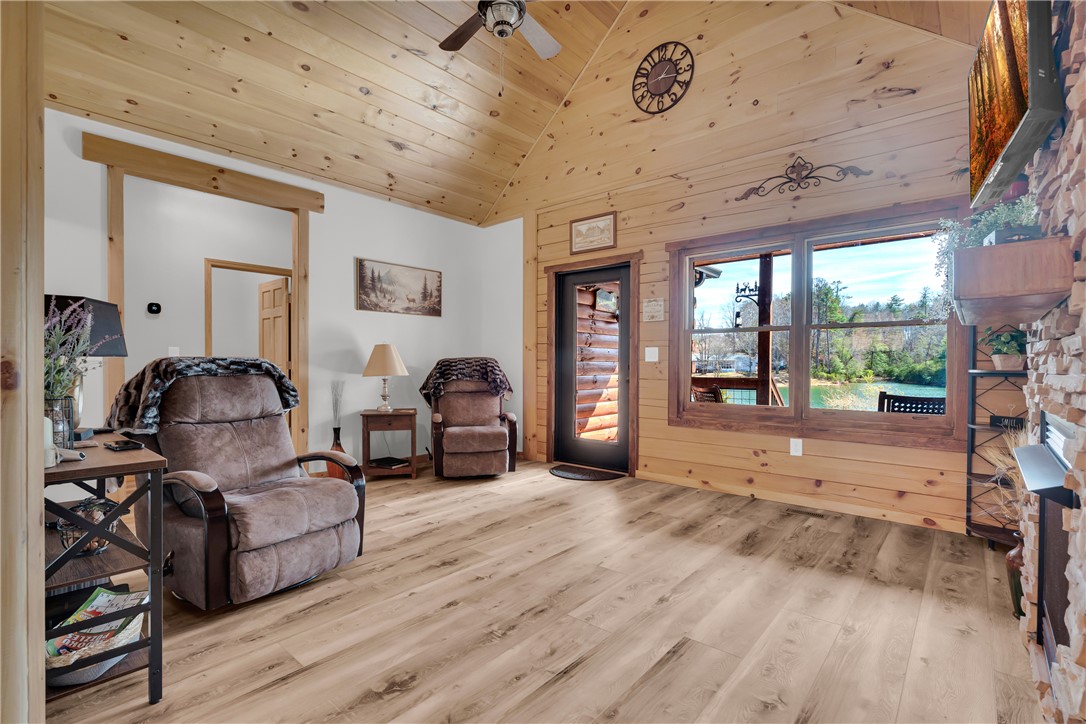 239 North Little River Road Salem, SC 29676 - Photo 19 of 43 This inviting living area boasts rich wooden accents and ample natural light, creating a warm and airy ambiance.