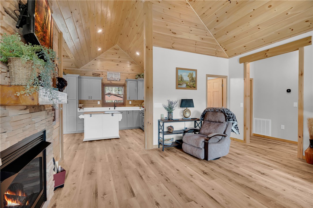 239 North Little River Road Salem, SC 29676 - Photo 20 of 43 This inviting interior features high ceilings and a cozy fireplace, perfect for gathering.