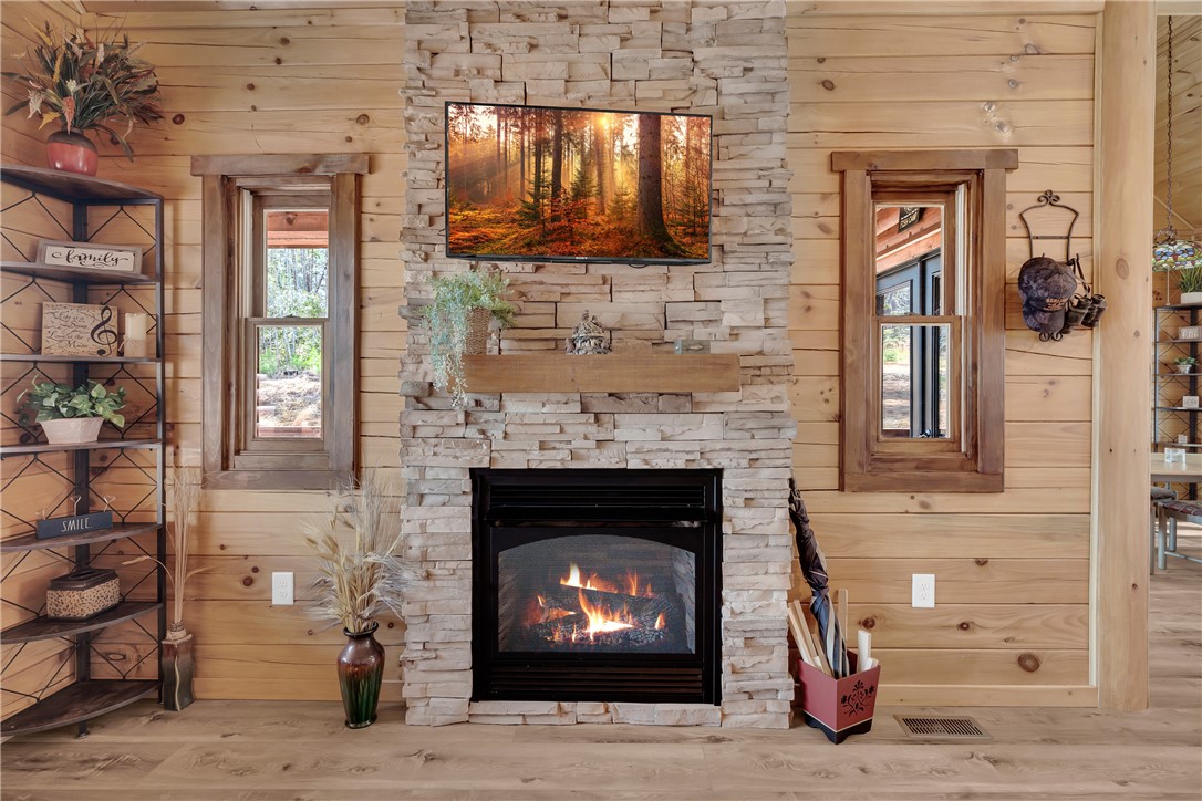 239 North Little River Road Salem, SC 29676 - Photo 22 of 43 Warm and inviting living space with a charming fireplace, perfect for cozy gatherings.