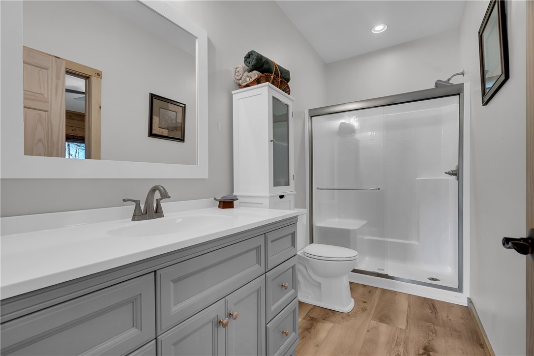 239 North Little River Road Salem, SC 29676 - Photo 25 of 43 This bathroom features a contemporary vanity and a spacious, clear-glass shower.