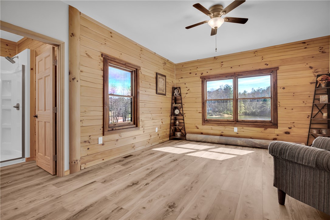 239 North Little River Road Salem, SC 29676 - Photo 26 of 43 This bright room features wide plank flooring and large windows with serene outdoor views.