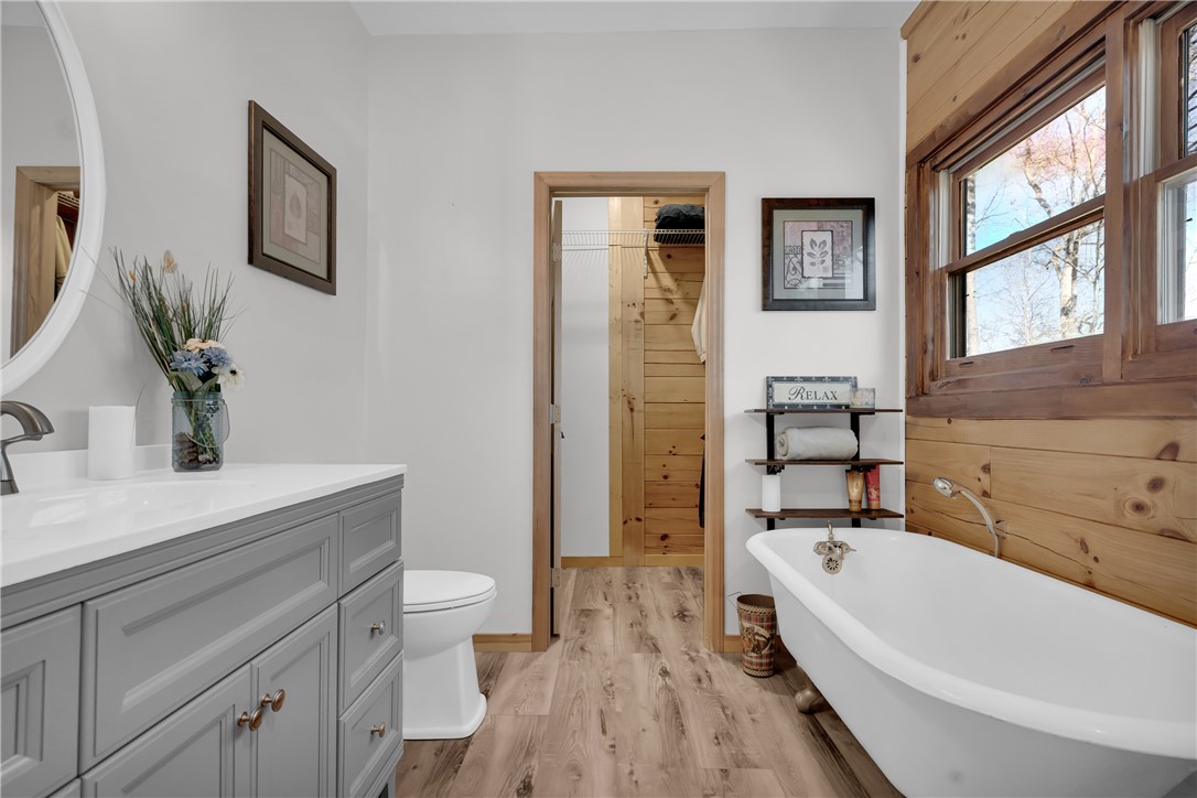 239 North Little River Road Salem, SC 29676 - Photo 30 of 43 This bathroom features a deep soaking tub and rustic wood accents, creating a serene retreat.